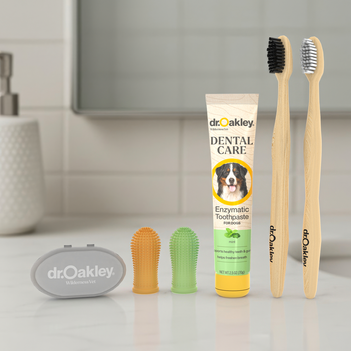 Dog dental care products including toothpaste, brushes, and tools on a bathroom counter.