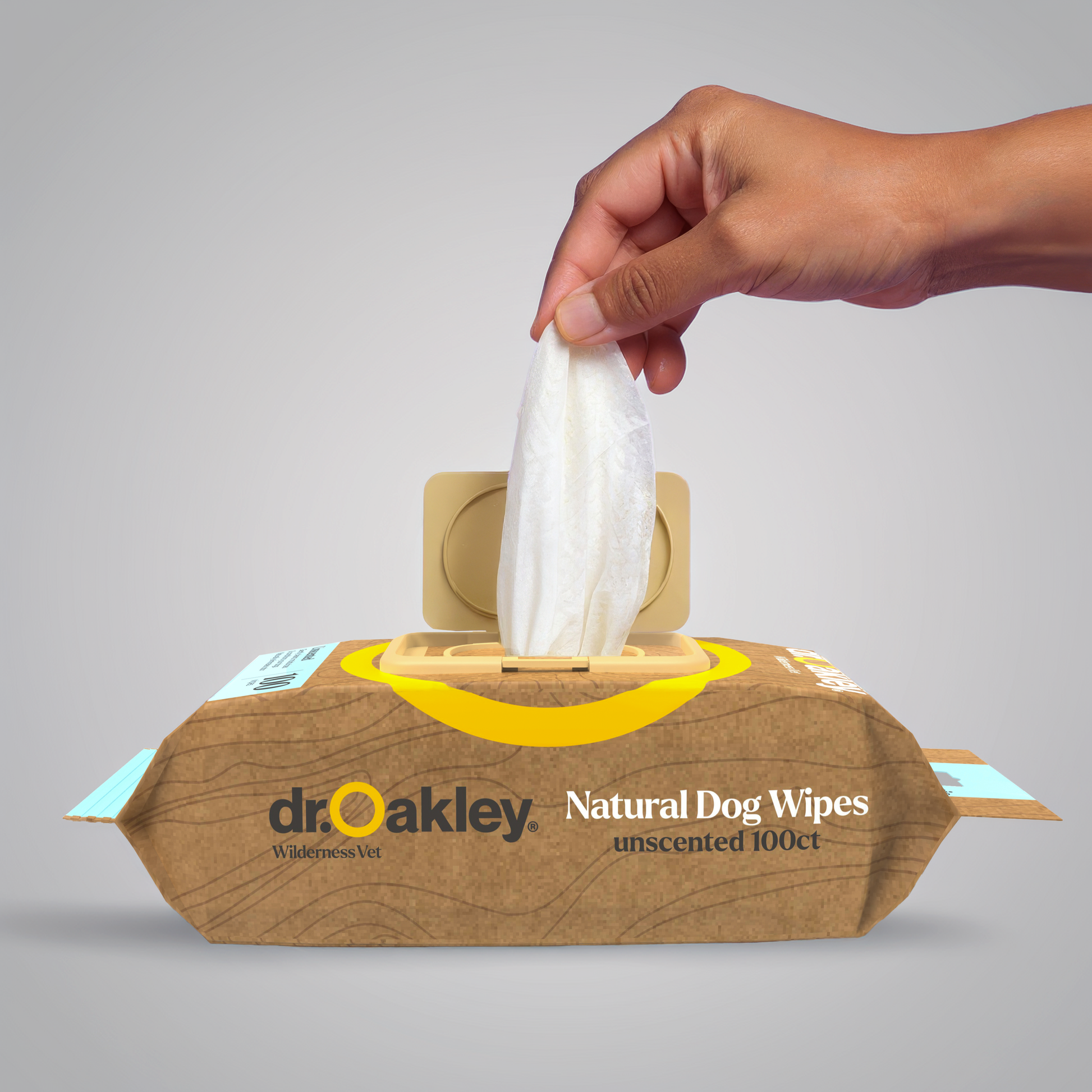 Dr. Oakley Natural Dog Wipes with a hand taking a wipe out of the box on a gray background